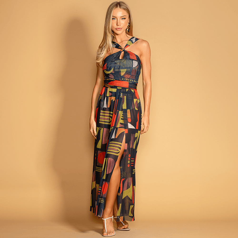 Vestido longo em tule, frente única e fendas laterais. Estampa encantadora e design elegante. Leveza e sofisticação para ocasiões especiais!