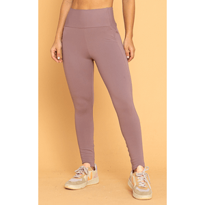 Calça legging blush com cós anatômico, detalhe fuseau e proteção UV 50+. Tecido premium com compressão para treinos ou looks versáteis.